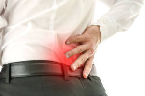 Detail of man suffering from back pain in auto accidents